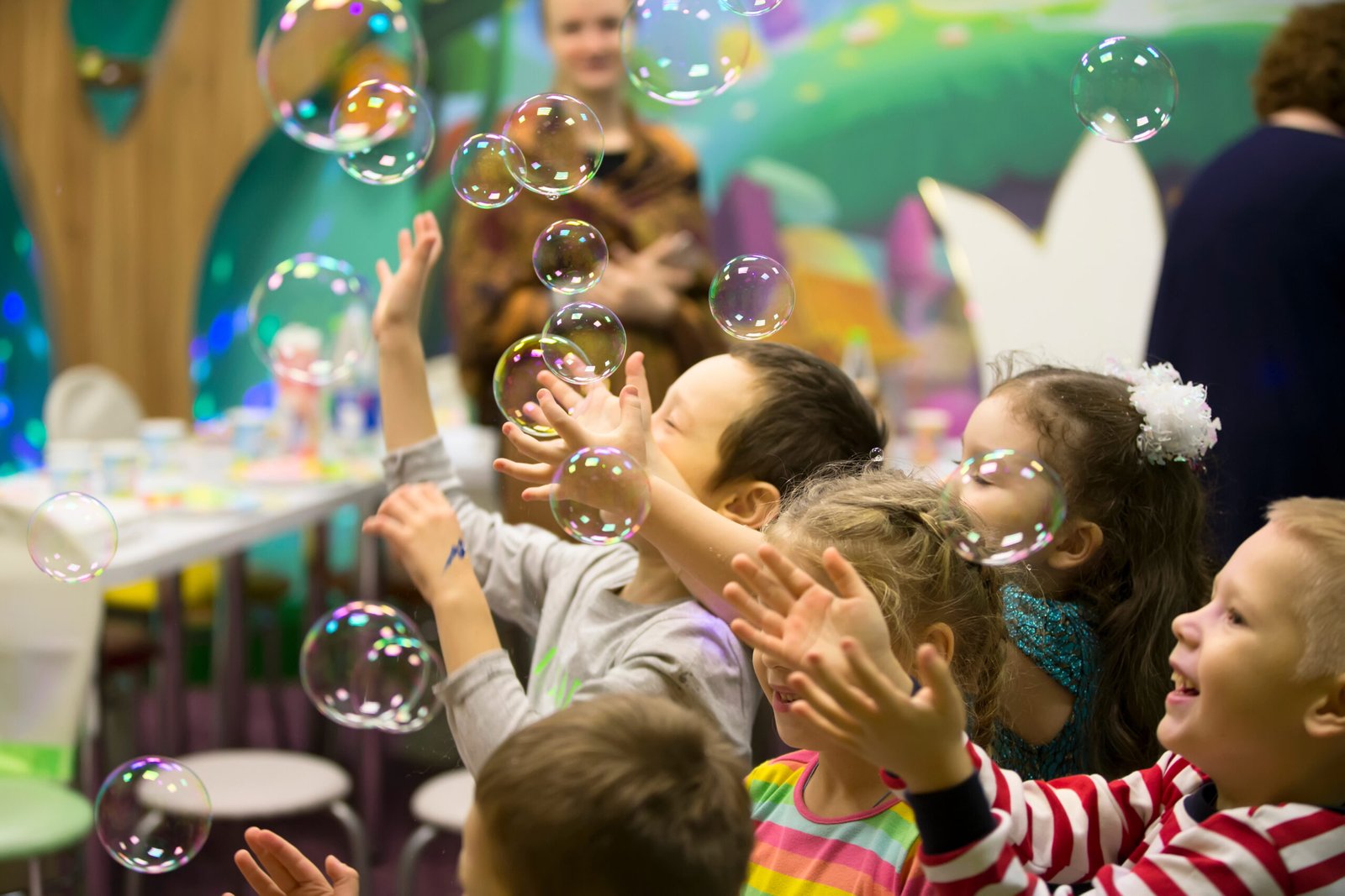 Belarus, Gomel, November 9, 2017. Gomel Children's Center.Children at the feast. Soap bubbles show. Children's party. To burst the soap bubble